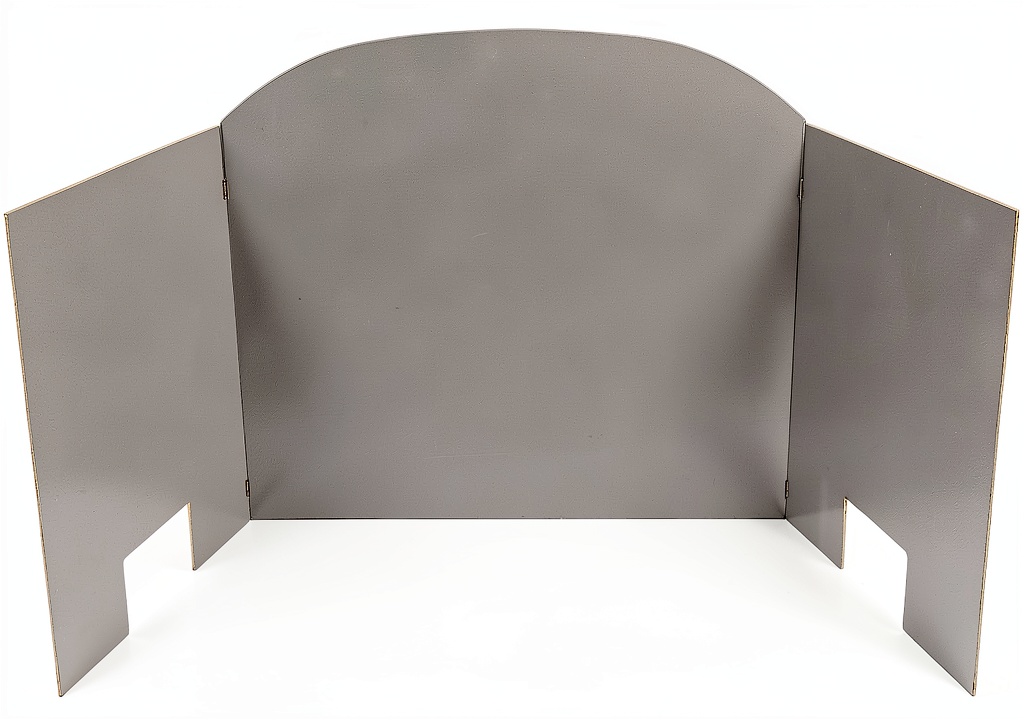 Stainless steel fireplace heat shield installed in a traditional living room